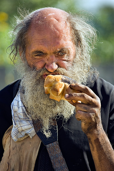     / Man with Bread